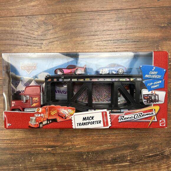 DISNEY PIXAR THE WORLD OF CARS. MACK TRANSPORTERRACE-O-RAMA RARE!!! New in Box